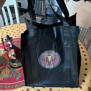 Black recycle bag with the band beat imprinted on it vip swag bag exclusive